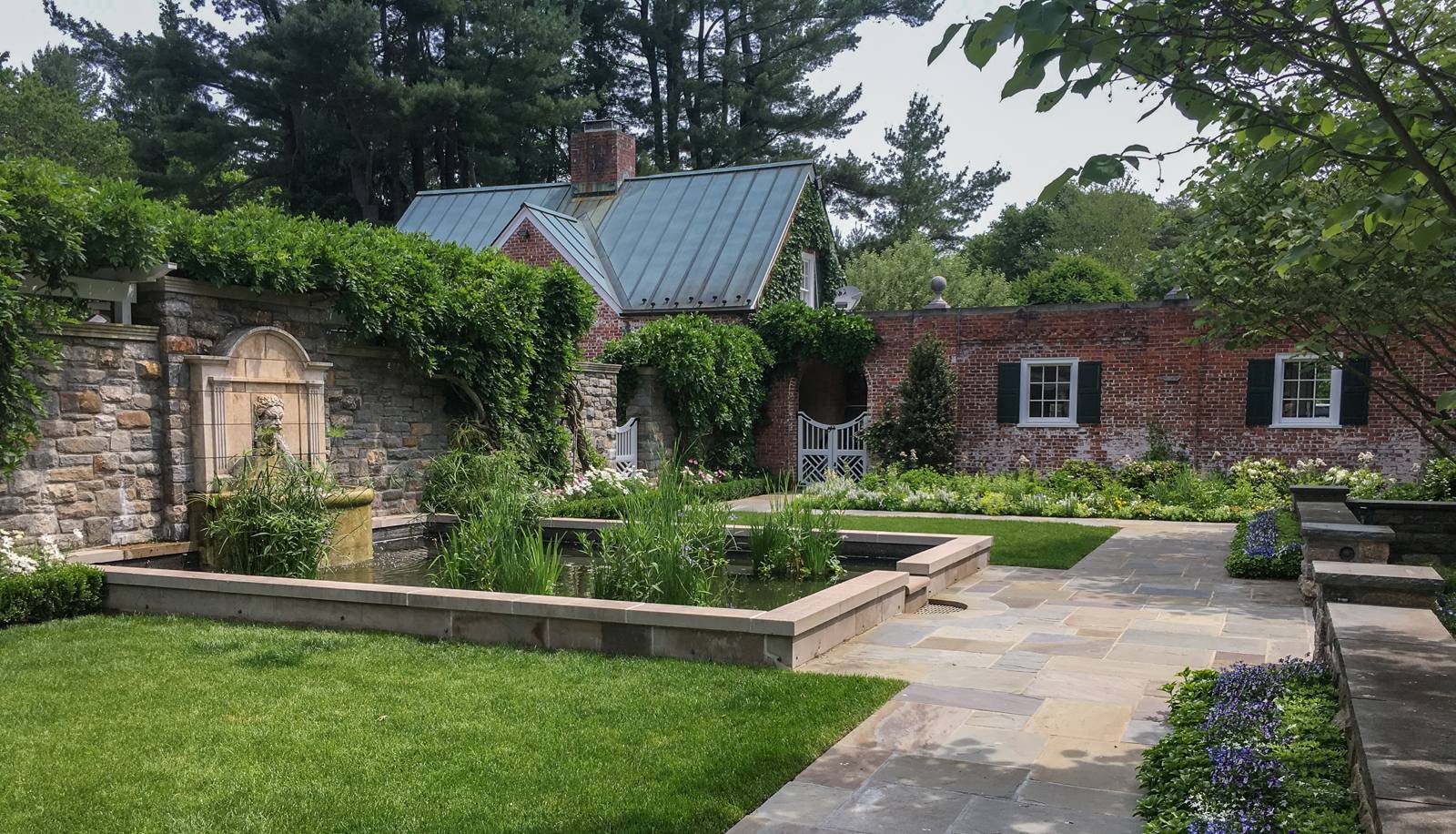 Fountain court with pond and bluestone paving